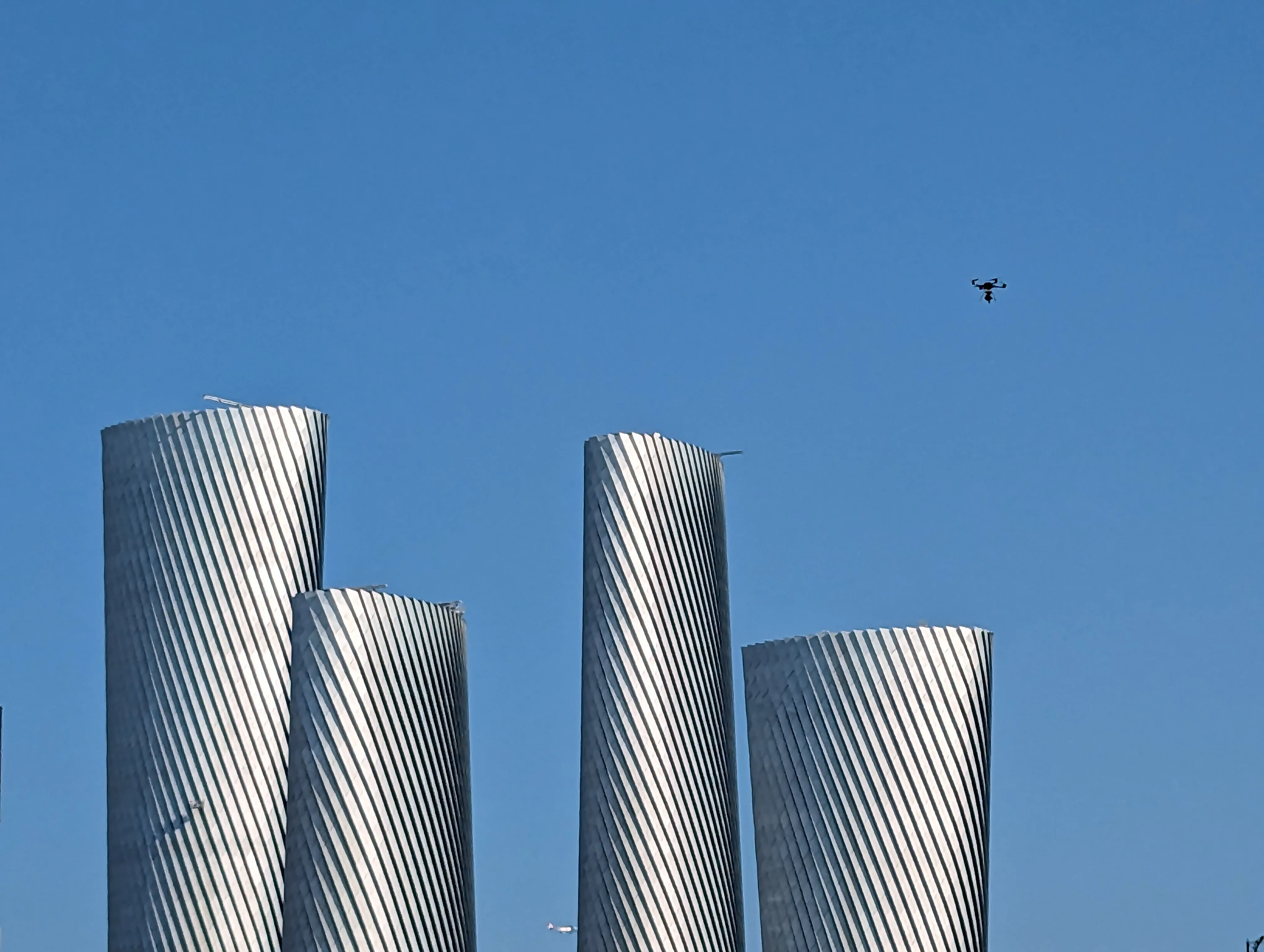 Drone flying above buildings.